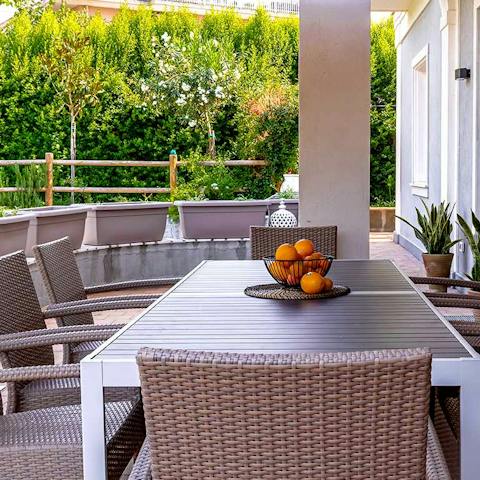 Gather outside and enjoy delicious meals and Sicilian wine