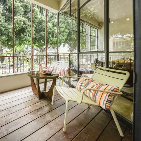 Sip limonana on the balcony after exploring the city's landmarks