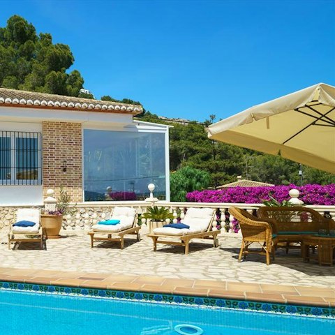 Bask in the sun on a comfortable poolside lounger