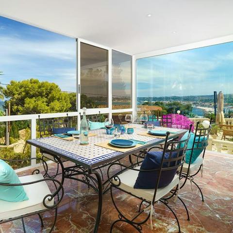 Eat meals in the shade of the covered terrace area