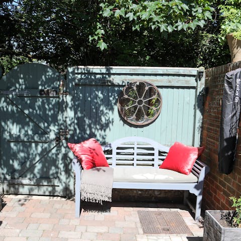 Sit in the sunny walled garden, dappled with ivy