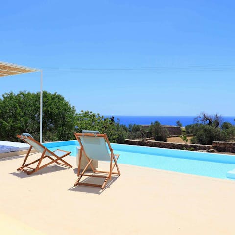 Soak up the sun on the private terrace as you enjoy the sea views