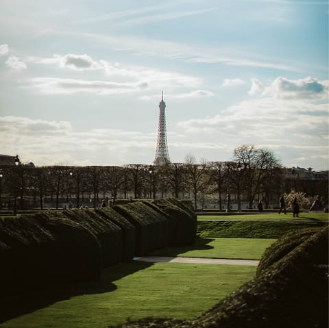 Take a morning stroll through the Tuileries Garden, a four-minute walk away