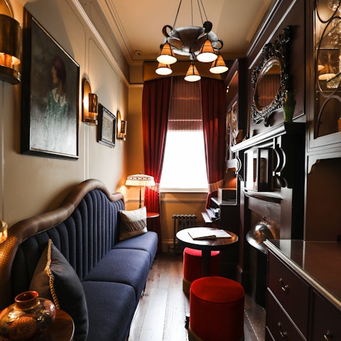 Sip a drink in the cocktail bar modelled on a period railway carriage
