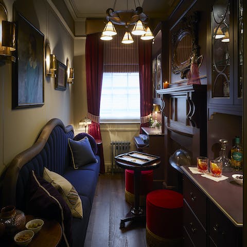 Sip a drink in the cocktail bar modelled on a period railway carriage