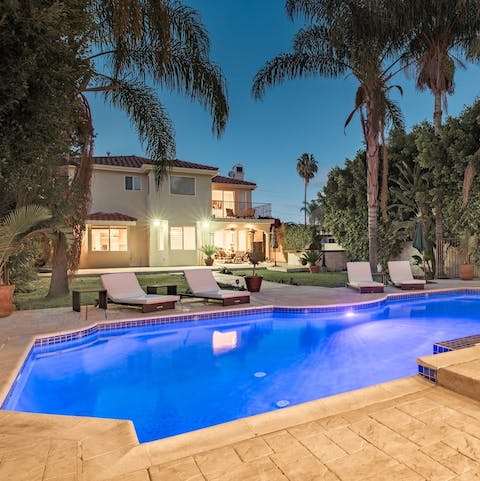 Lounge beneath the palms by your private pool