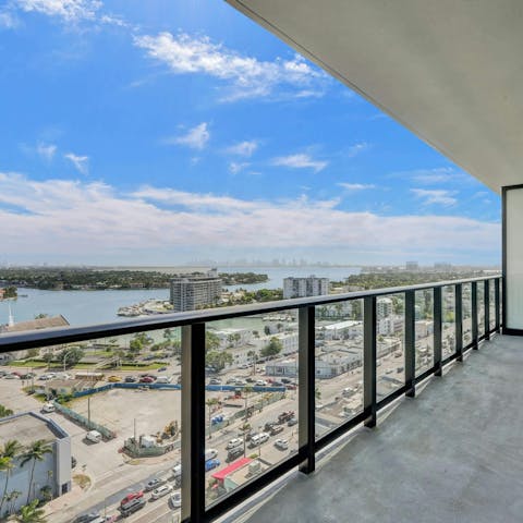 Admire the views of the Atlantic Ocean and the city skyline from this home’s balcony