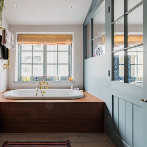 Indulge in a soak in the tub, encased in iroko wood