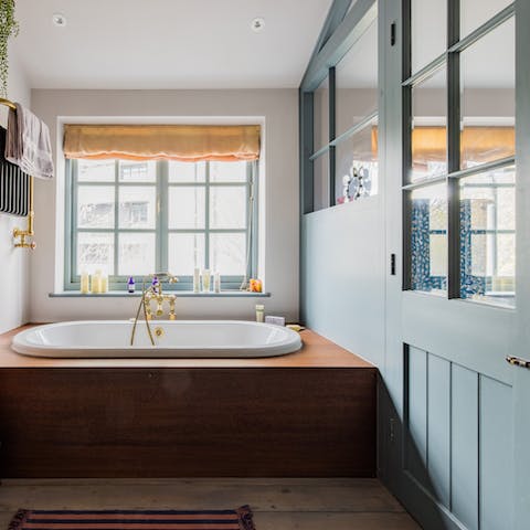 Indulge in a soak in the tub, encased in iroko wood
