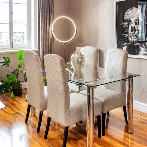 Share delicious family meals at the glass dining table