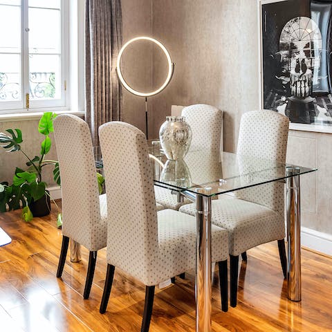 Share delicious family meals at the glass dining table