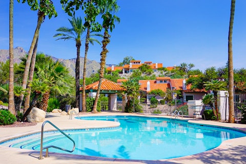 Cool off in the resort pool with the Catalina Mountains as a backdrop