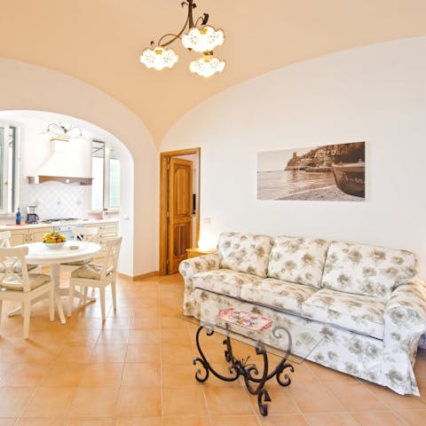 Snuggle up in the bright living room and enjoy a movie nigh on the comfy sofa