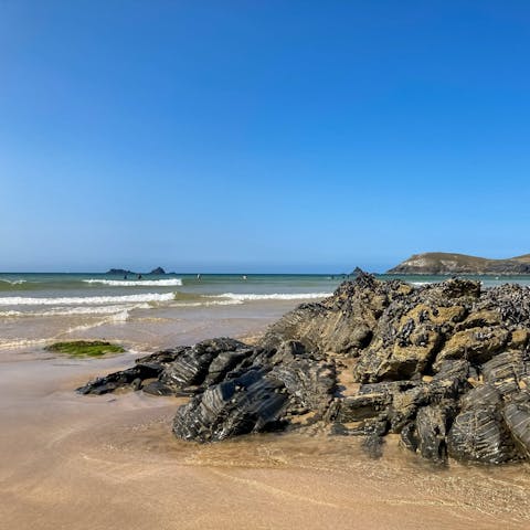 Sink your feet into the sand at Rock beach, just 1.6km away