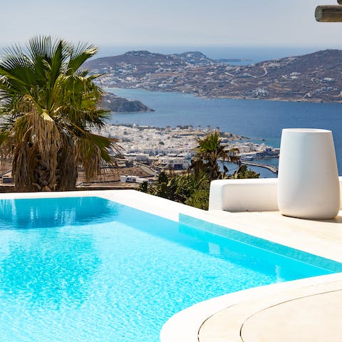 Gaze out over the island from the water of your inviting infinity pool