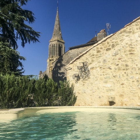 Swim in the pool with a view of the 19th century church