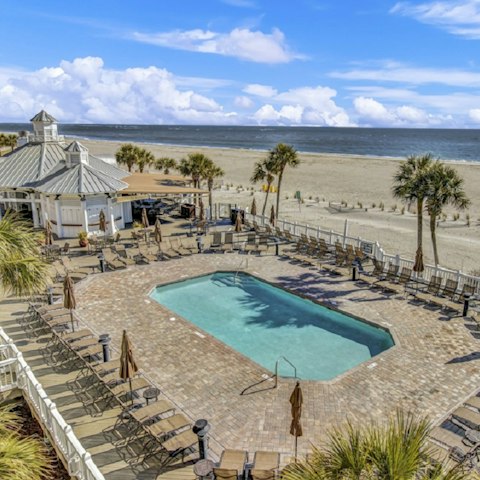 Take a dip in the shared beachfront pool