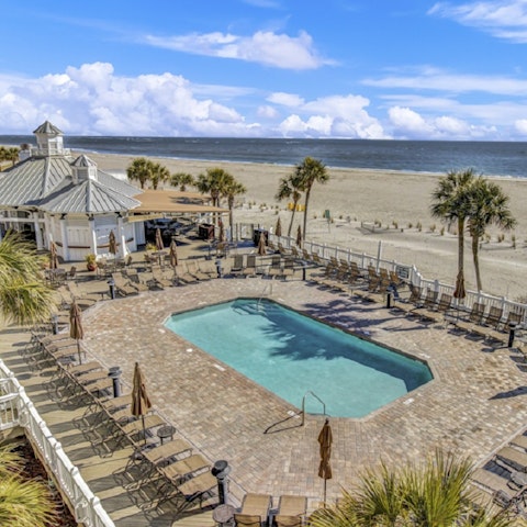 Take a dip in the shared beachfront pool