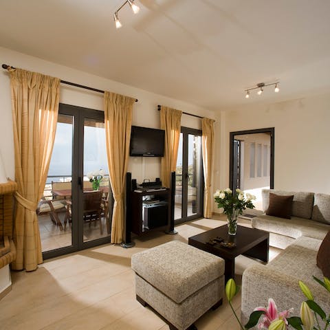 Relax in the comfortable living space with earthy tones