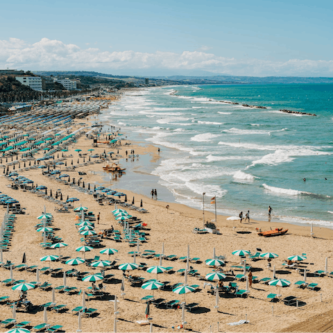Walk to Marina di Grosseto's soft-sanded beach, 300 metres away