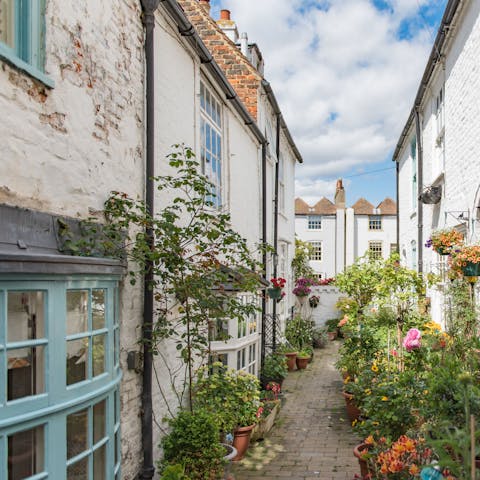 Step out into this cheery, floral pedestrianised lane