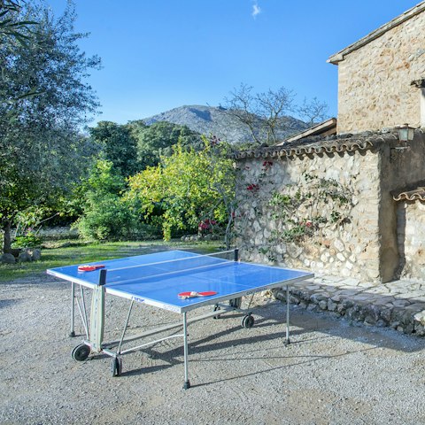 Challenge your group to a game of table tennis in the sunshine