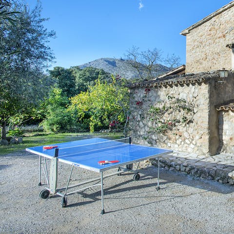 Challenge your group to a game of table tennis in the sunshine