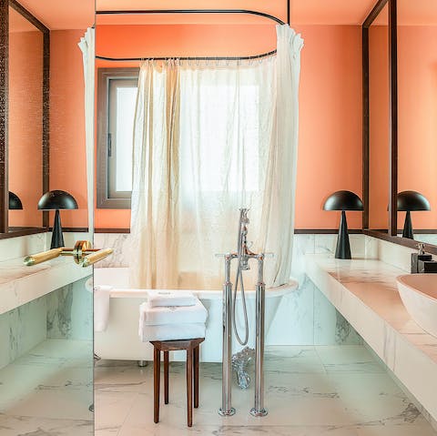 Soak away your stresses in the lavish roll top bath