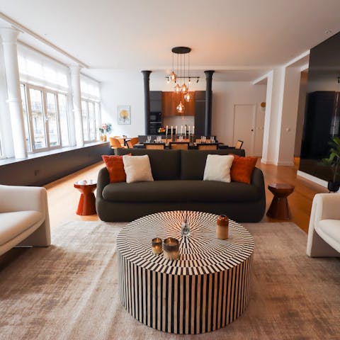 Relax in the architect-designed loft-style living space with a glass of Champagne