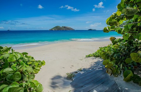 Step onto the sand with Chevreau Island on the horizon
