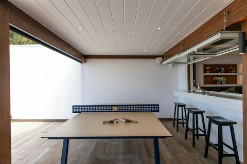 Challenge the group to a ping pong match under the shaded pergola