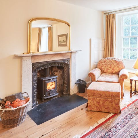 Put some kindling onto the log burner and snuggle up on the armchair