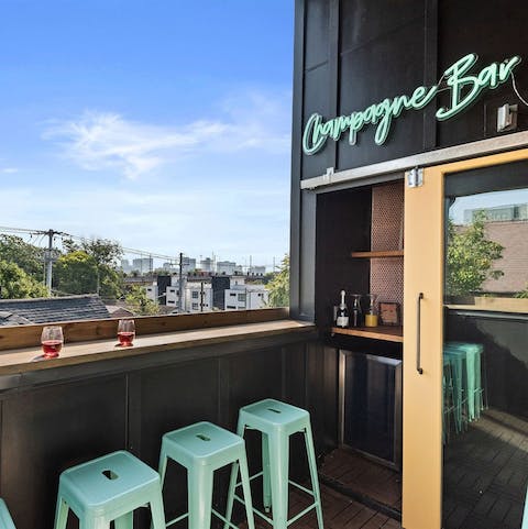 Pop open something fizzy and enjoy on the rooftop "champagne bar"