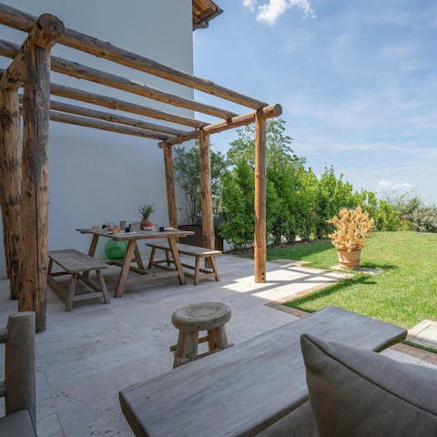 Enjoy a glass of wine in the sunshine on the private patio
