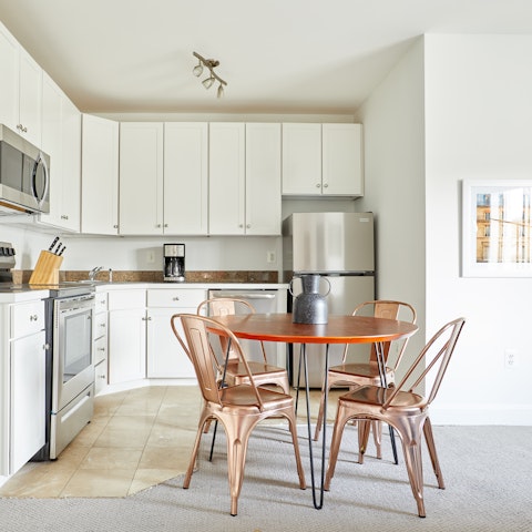 Enjoy a homecooked meal around the dining table, or make it your office for the day and work remotely