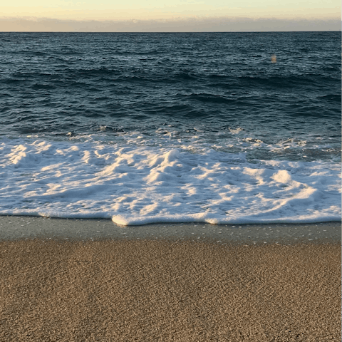 Relax on the white sands of Ca'n Pere Antoni Beach, a five-minute stroll away