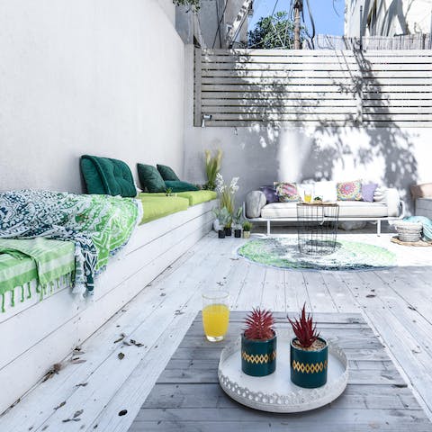 Enjoy drinks and nibbles outside in the sun as you take to the bench or outdoor sofa