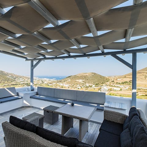 Open a bottle of wine and relax on the outdoor sofa