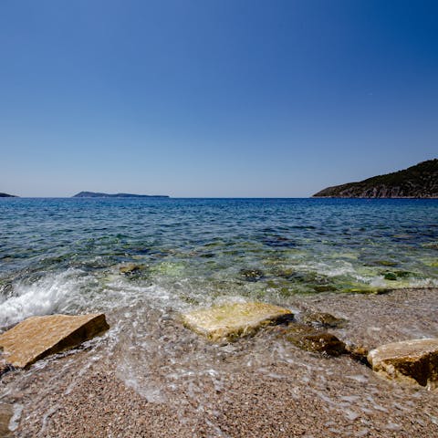 Stroll down to the little pebble beach just moments from your door