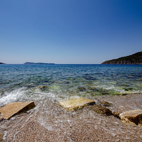Stroll down to the little pebble beach just moments from your door