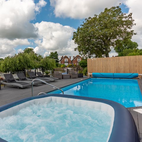 Unwind in the jacuzzi with a glass of Champagne or relax on a lilo in the heated swimming pool