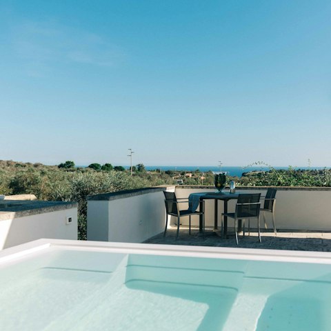 Admire sea views from the rooftop Jacuzzi
