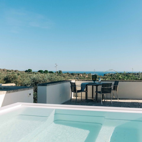 Admire sea views from the rooftop Jacuzzi