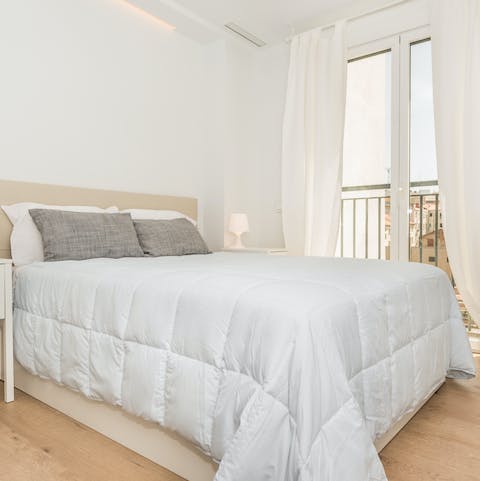 Wake up to rooftop views from the bedroom's Juliet balcony