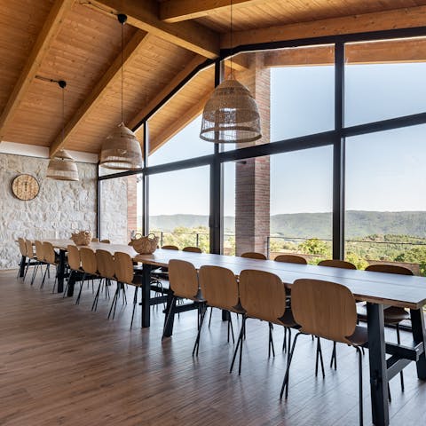Dine as a group with a view of the foothills of the Pyrenees
