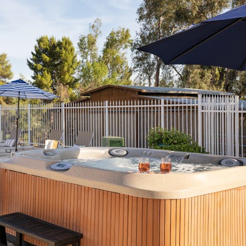 Slip into your swimwear and sit in the garden's hot tub