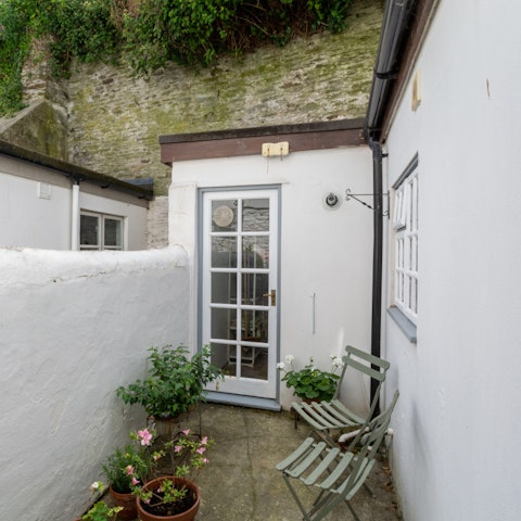Sit in the courtyard garden with a glass of wine