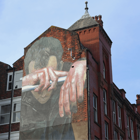 Discover street art in The Northern Quarter, a seven-minute walk away