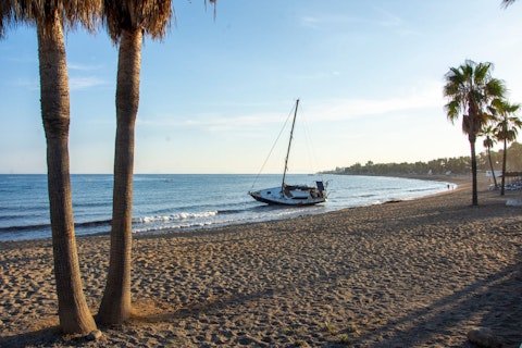 Sink your toes into the sand of Nagüeles Beach, a ten-minute walk away