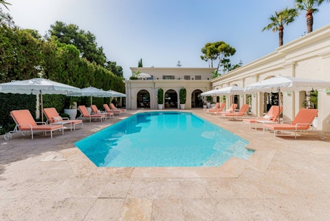 Lounge poolside with a glass of something chilled in hand